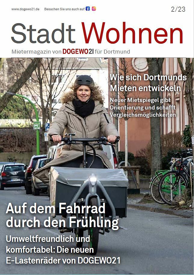 Titelbild des Mietermagazins von DOGEWO21, auf dem eine junge Frau auf einem Elektro-Lastenfahrrad fährt